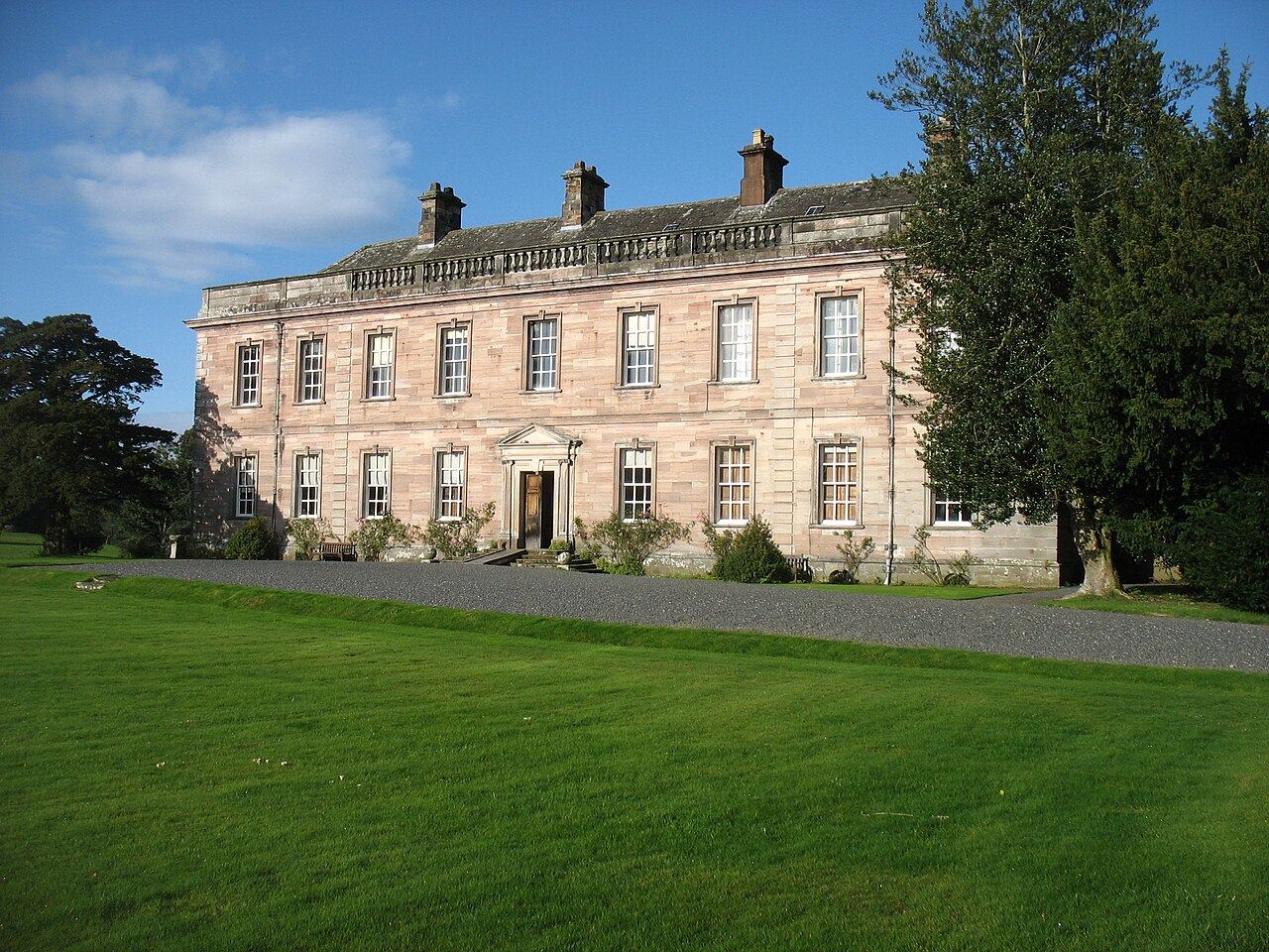 Dalemain House, a pink sandstone Georgian frontage with lawns in front