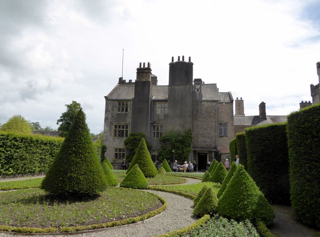 Levens Hall, an Elizabethan stone house with topiary in front