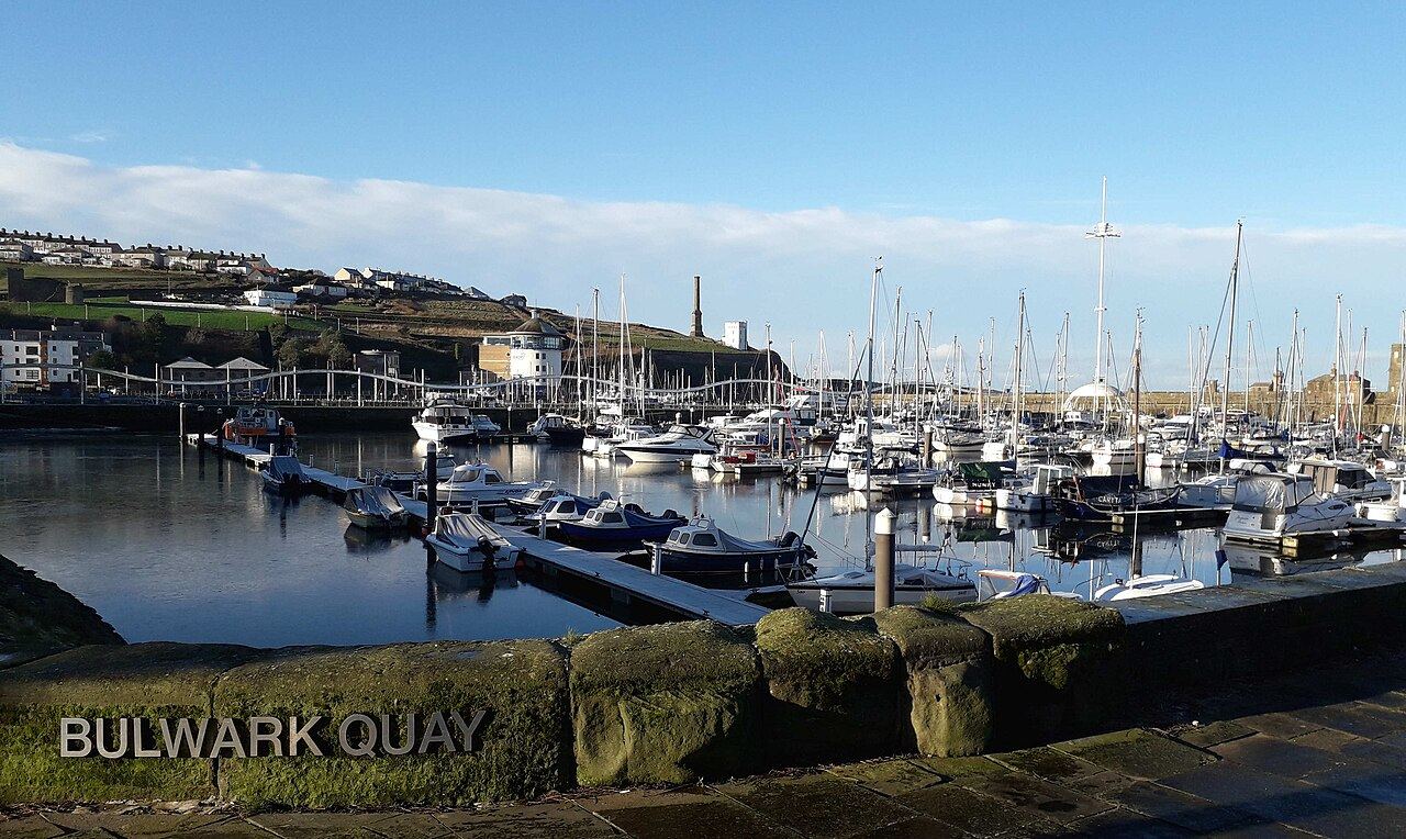 Whitehaven marina with the Beacon Museum and the Candlestick chimney above the harbour
